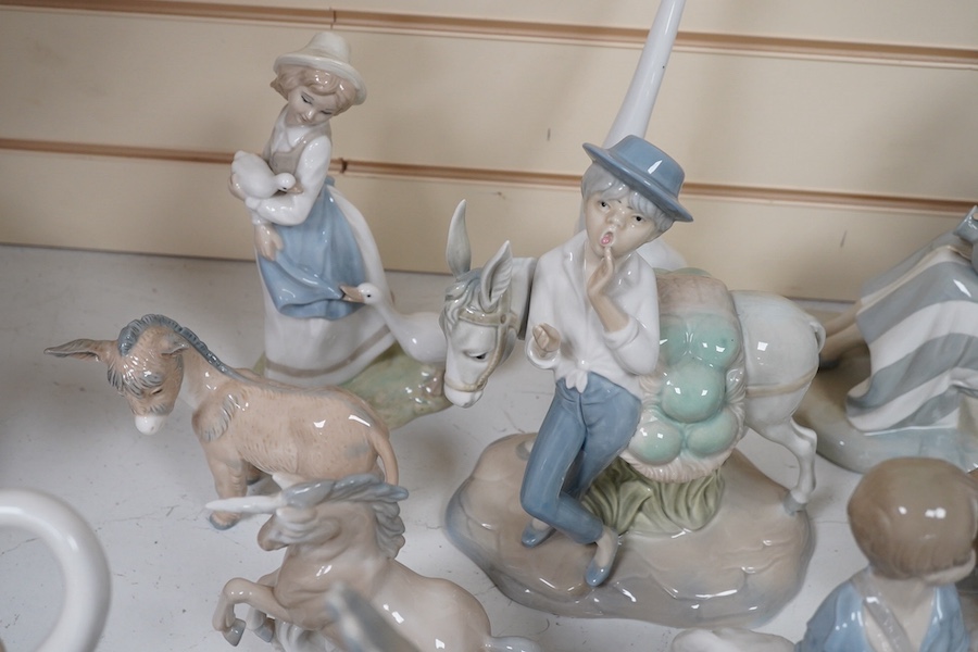 A quantity of Lladro style and Nao figures (12). Condition - good